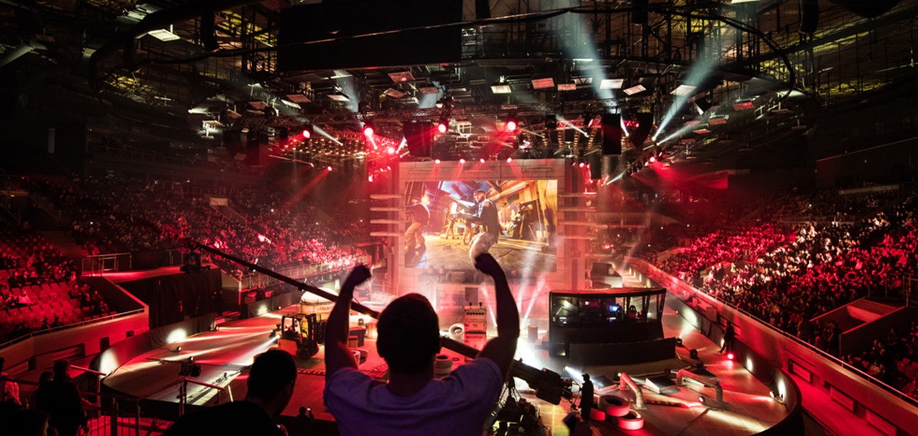 cheering crowd watches an esports tournament,