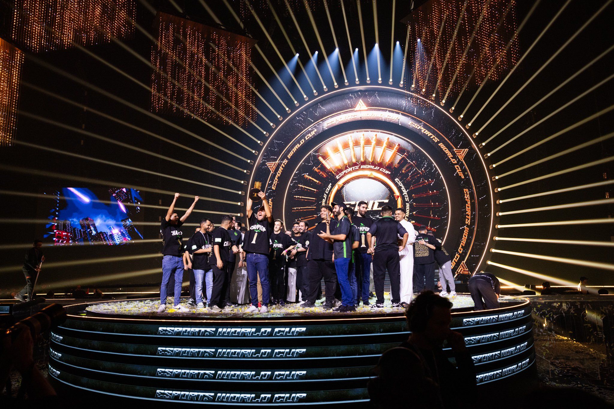 group of champions celebrating on stage