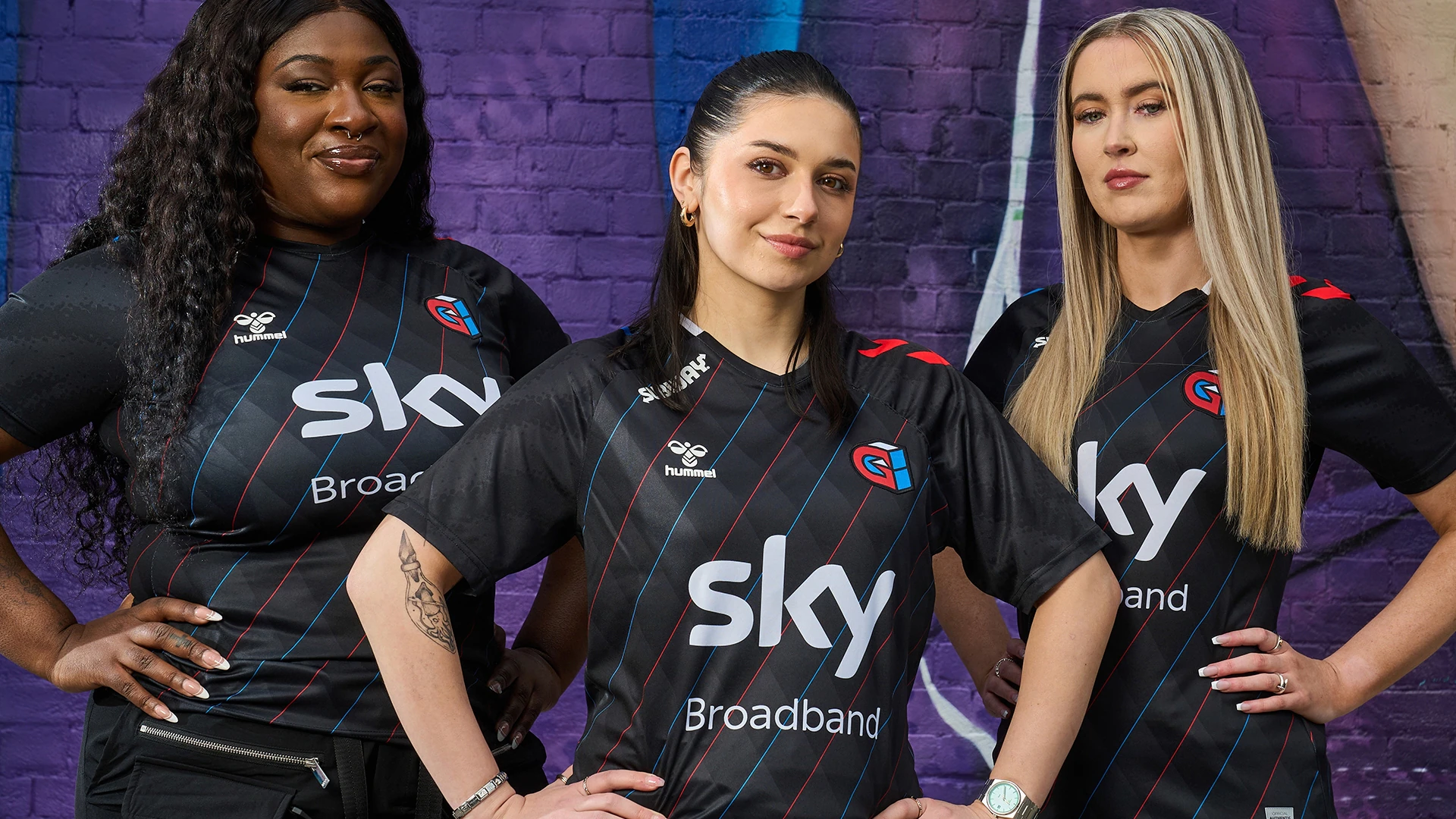 women stand confidently in matching black sports jerseys